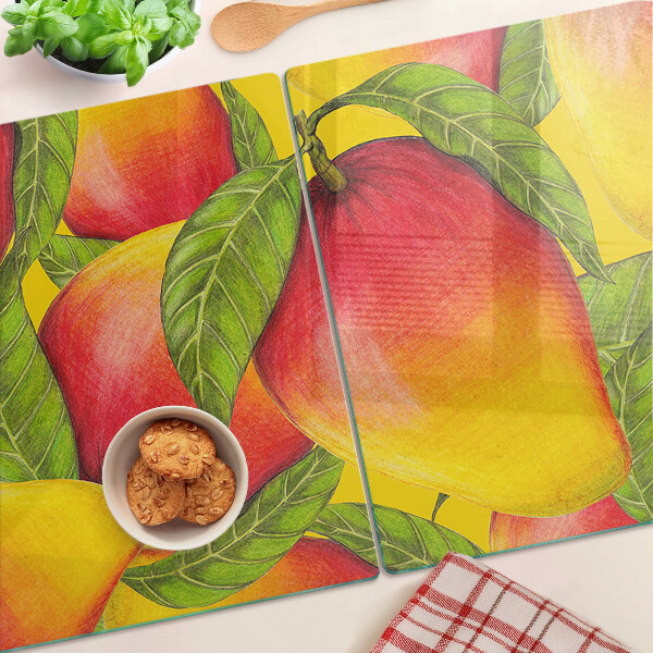 Tagliere in vetro temperato con motivo di peperoni su sfondo di foglie verdi