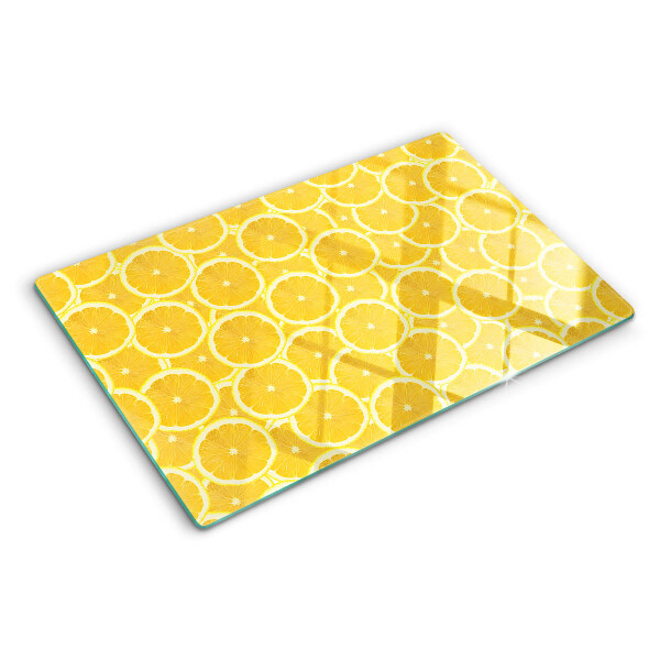 Tagliere in vetro temperato Fette di limone su sfondo giallo