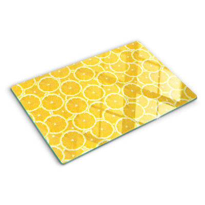 Tagliere in vetro temperato Fette di limone su sfondo giallo