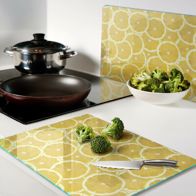 Tagliere in vetro temperato Fette di limone su sfondo giallo