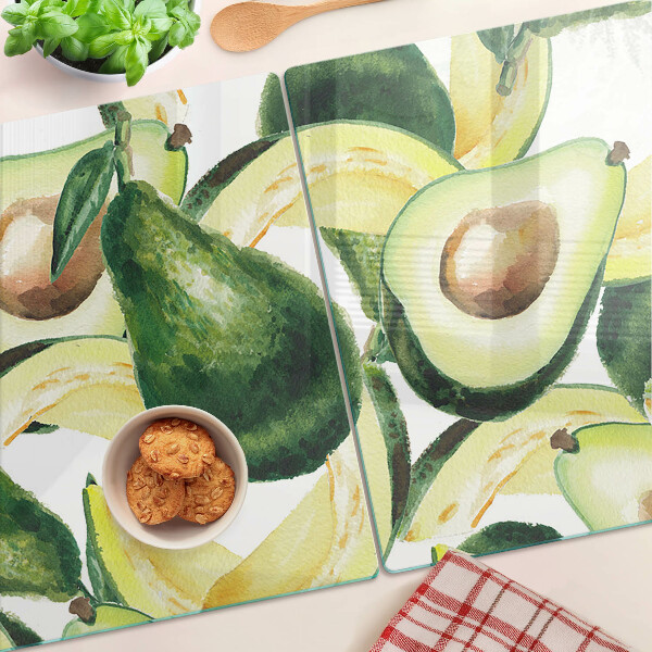 Tagliere in vetro temperato con motivo di avocado su sfondo di foglie