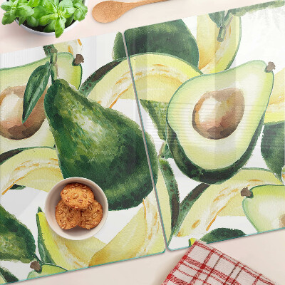 Tagliere in vetro temperato Avocado sullo sfondo di foglie