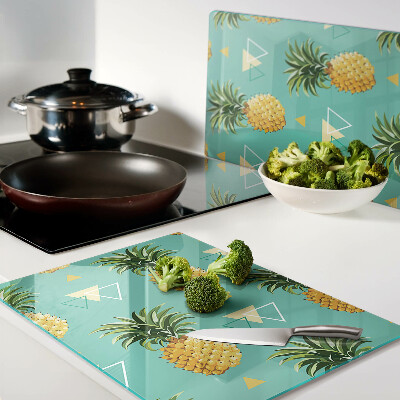 Tagliere in vetro temperato con stampa di ananas su sfondo turchese