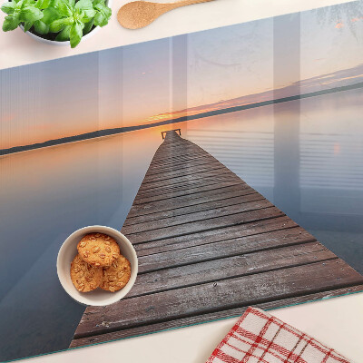 Tagliere in vetro temperato con stampa raffigurante un pontile sul lago al tramonto