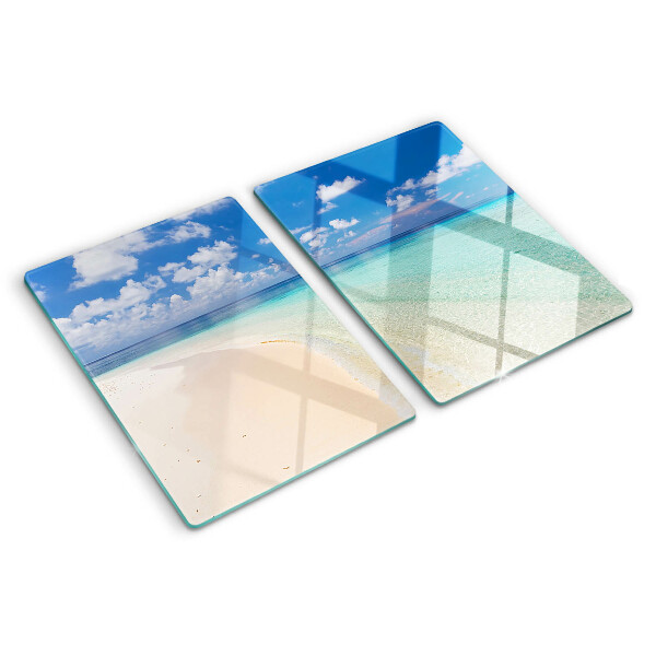 Tagliere in vetro con stampa della spiaggia sotto un cielo azzurro
