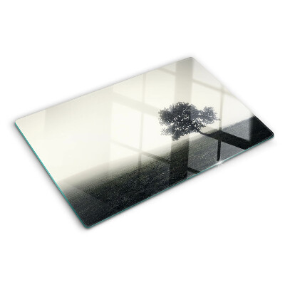 Tagliere in vetro temperato con stampa di un albero in un paesaggio nebbioso