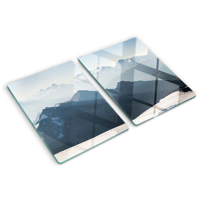 Tagliere in vetro con stampa di un paesaggio montano tra le nuvole