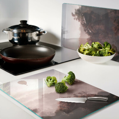 Tagliere in vetro temperato con decorazione a mongolfiera su paesaggio