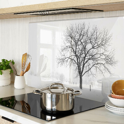 Tagliere in vetro temperato con stampa di un paesaggio invernale desolato con albero