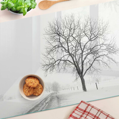 Tagliere in vetro temperato con stampa di un paesaggio invernale desolato con albero