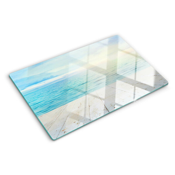 Tagliere in vetro con stampa raffigurante il mare e un pontile di legno