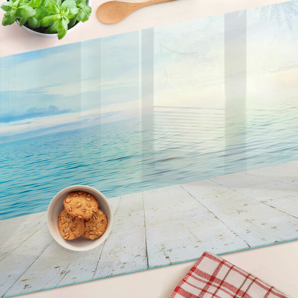 Tagliere in vetro con stampa raffigurante il mare e un pontile di legno