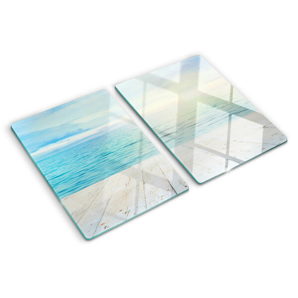 Tagliere in vetro con stampa raffigurante il mare e un pontile di legno