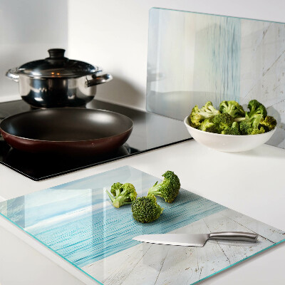 Tagliere in vetro con stampa raffigurante il mare e un pontile di legno