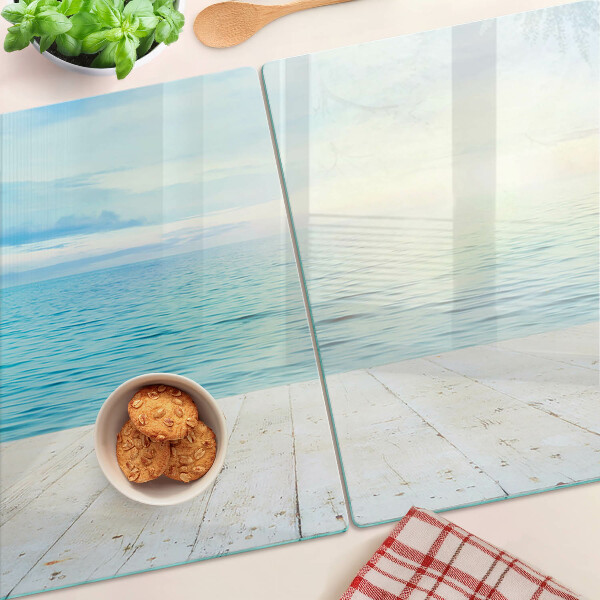 Tagliere in vetro con stampa raffigurante il mare e un pontile di legno