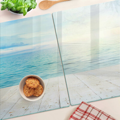 Tagliere in vetro con stampa raffigurante il mare e un pontile di legno