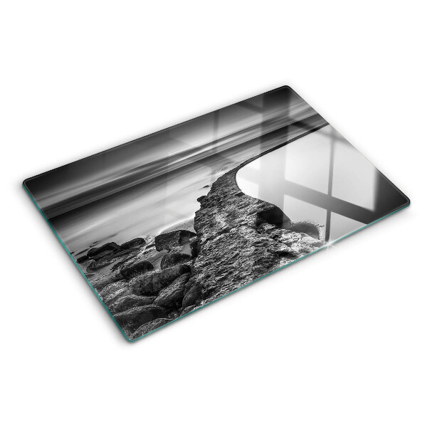 Tagliere in vetro temperato con stampa di un paesaggio costiero nei toni del grigio