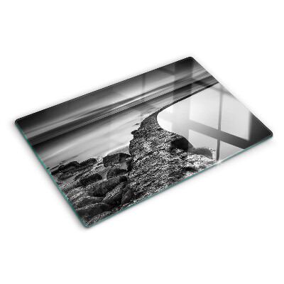 Tagliere in vetro temperato con stampa di un paesaggio costiero nei toni del grigio