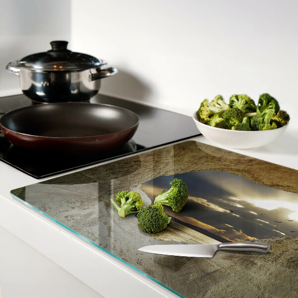 Tagliere in vetro temperato con stampa raffigurante la vista sul mare attraverso una grotta