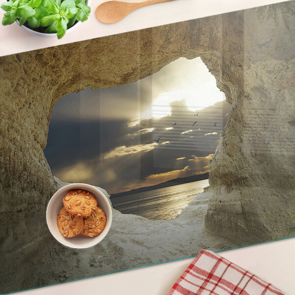 Tagliere in vetro temperato con stampa raffigurante la vista sul mare attraverso una grotta