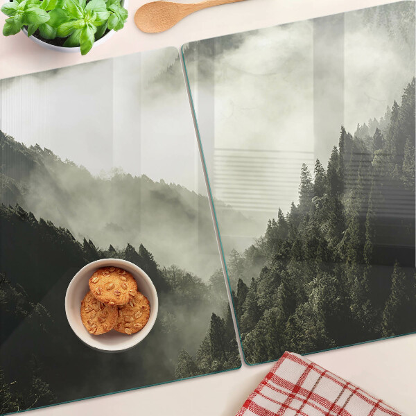 Tagliere in vetro temperato con stampa di un paesaggio montano avvolto nella nebbia