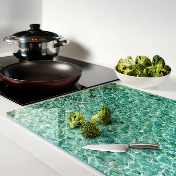 Tagliere in vetro con motivo acqua a effetto piscina