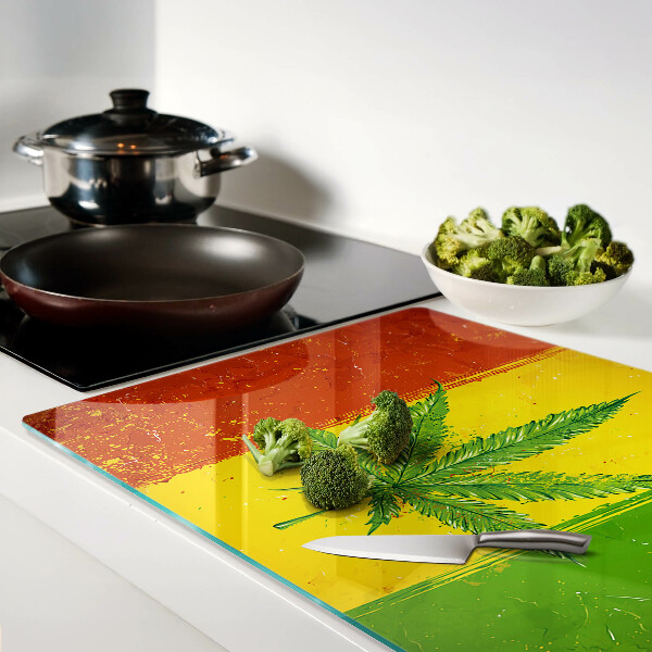 Tagliere in vetro temperato con stampa di foglia di canapa su sfondo colorato