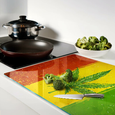 Tagliere in vetro temperato con stampa di foglia di canapa su sfondo colorato