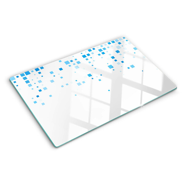 Tagliere in vetro con motivo di quadrati blu su sfondo bianco
