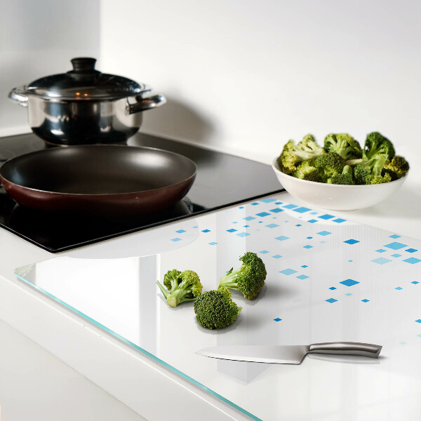 Tagliere in vetro con motivo di quadrati blu su sfondo bianco