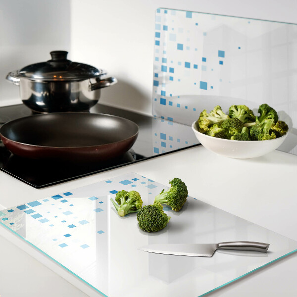 Tagliere in vetro con motivo di quadrati blu su sfondo bianco