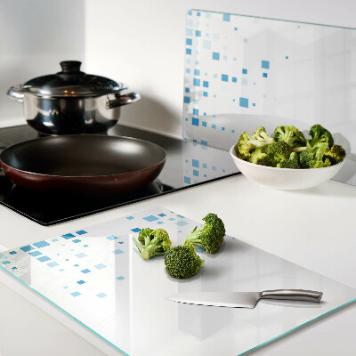 Tagliere in vetro con motivo di quadrati blu su sfondo bianco