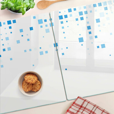 Tagliere in vetro con motivo di quadrati blu su sfondo bianco