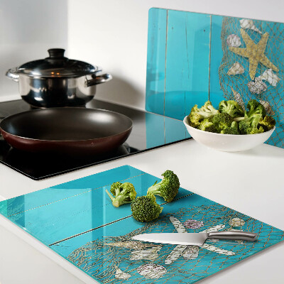 Tagliere in vetro temperato con decorazione di conchiglie e stelle marine