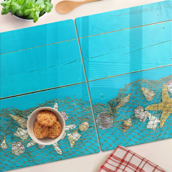 Tagliere in vetro temperato con decorazione di conchiglie e stelle marine