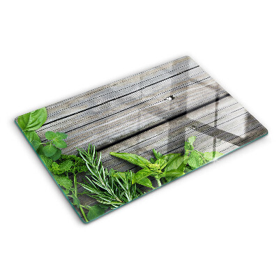 Tagliere in vetro temperato con motivo di erbe verdi su sfondo in legno