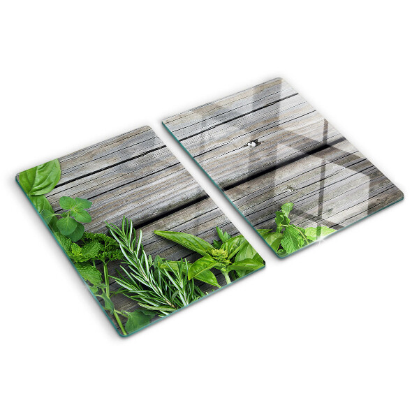 Tagliere in vetro temperato con motivo di erbe verdi su sfondo in legno