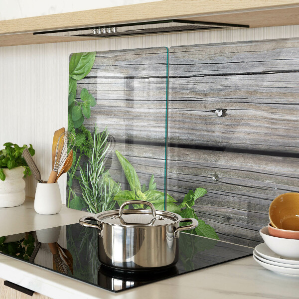 Tagliere in vetro temperato con motivo di erbe verdi su sfondo in legno