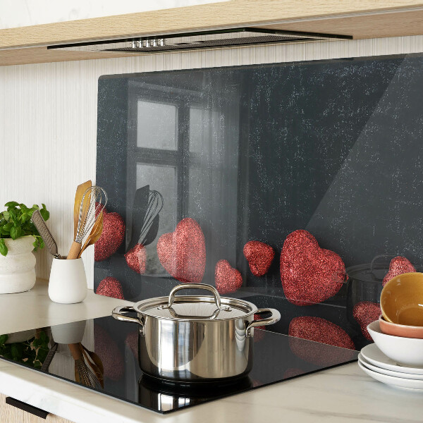 Tagliere in vetro temperato con motivo a cuori rossi su sfondo scuro