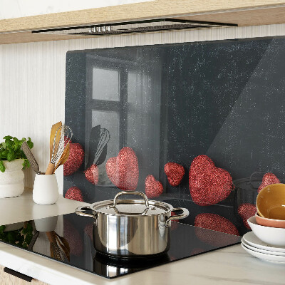 Tagliere in vetro temperato con motivo a cuori rossi su sfondo scuro