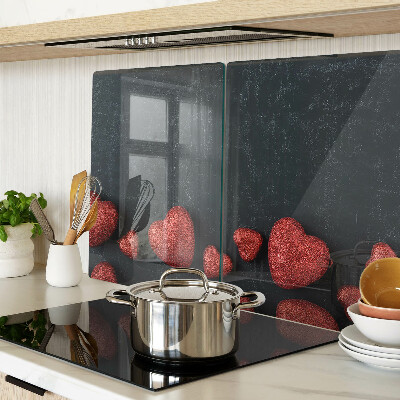 Tagliere in vetro temperato con motivo a cuori rossi su sfondo scuro