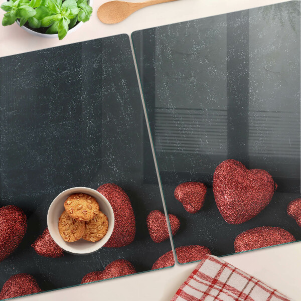 Tagliere in vetro temperato con motivo a cuori rossi su sfondo scuro