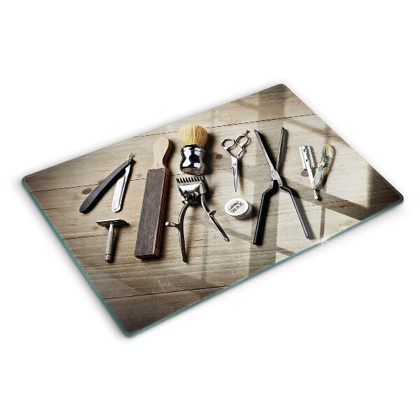 Tagliere in vetro con motivo di strumenti per parrucchieri su sfondo di legno