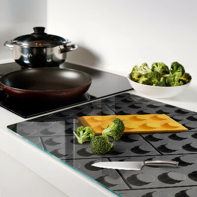 Tagliere in vetro con stampa di mattoncini LEGO su sfondo nero