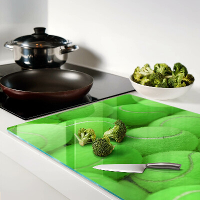 Tagliere in vetro temperato con motivo di palle da tennis su sfondo verde