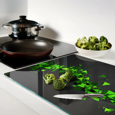 Tagliere in vetro temperato con motivo a triangoli verdi su sfondo nero