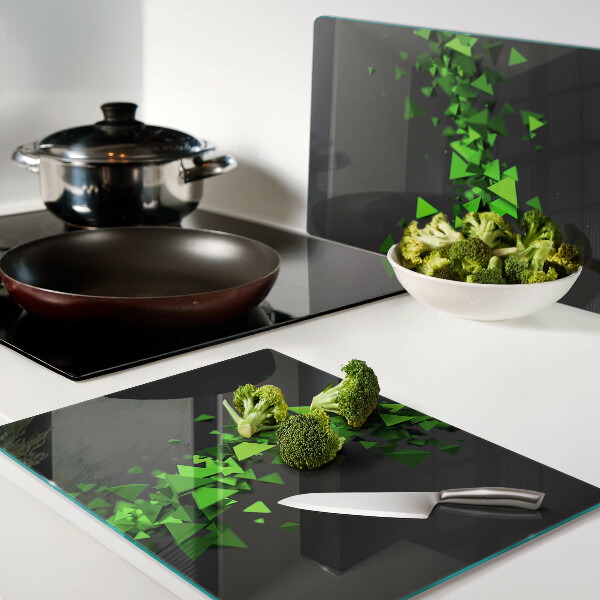 Tagliere in vetro temperato con motivo a triangoli verdi su sfondo nero