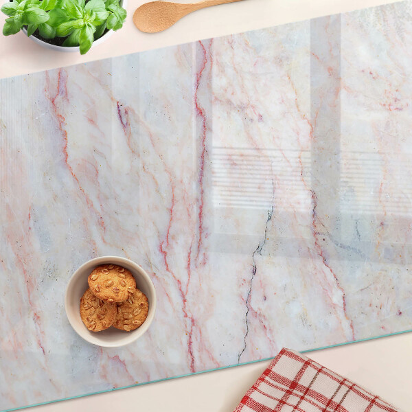 Tagliere in vetro temperato con motivo marmorizzato nei toni del rosa