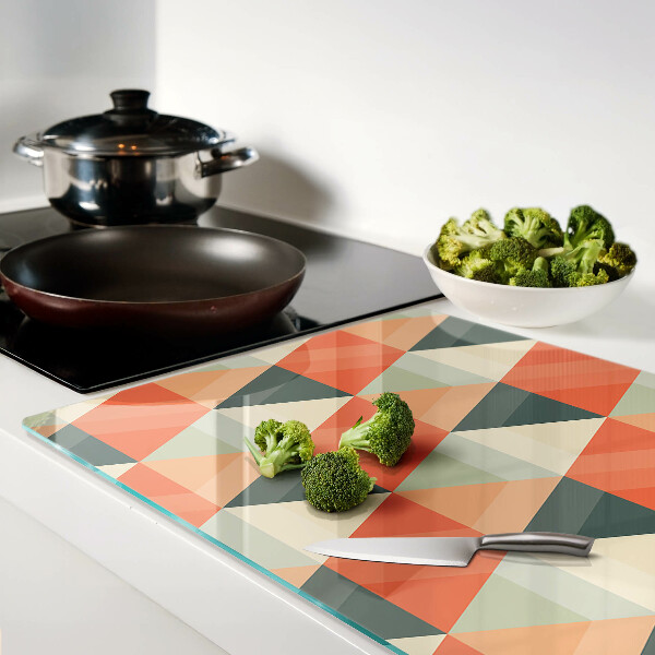 Tagliere in vetro temperato con motivo a triangoli nei toni dell'arancione