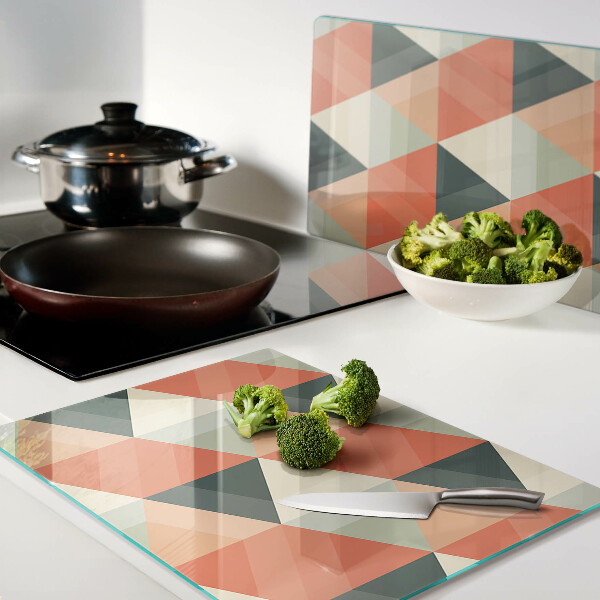 Tagliere in vetro temperato con motivo a triangoli nei toni dell'arancione